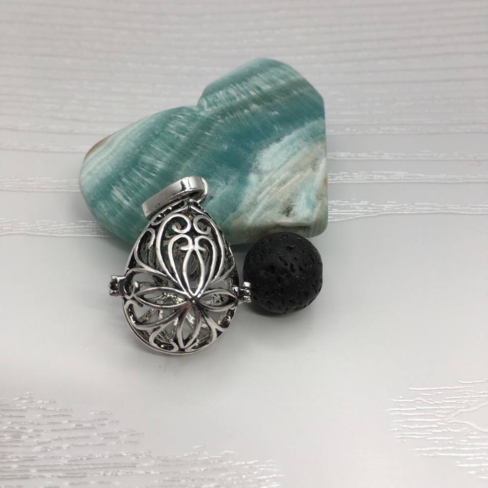 Pattern Egg Shaped Aromatherapy Silver tone Locket.  Lava stone included.